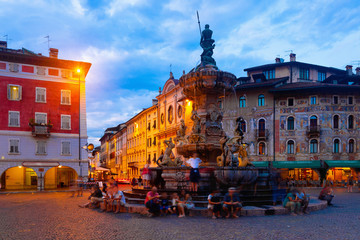 Nettuno Fountain in Duomo square and Civic tower. Trento. Italy