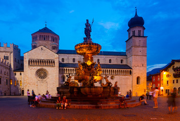 Fountain of Neptune and cathedral on Piazza Duomo in Trento in evening