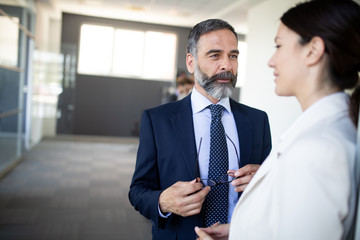 Business people having fun and chatting at workplace office