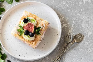 Pavlova on a biscuit with a gentle curd cream and fruit.