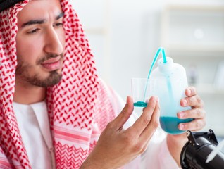 Arab chemist checking the quality of drinking water