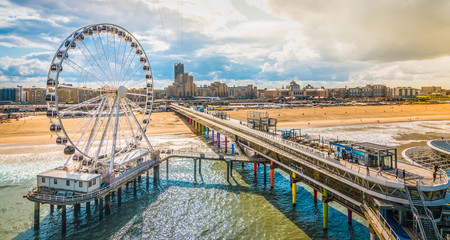 Scheveningen, The Hague, The Netherlands. Ferris wheel and pier at the beach.