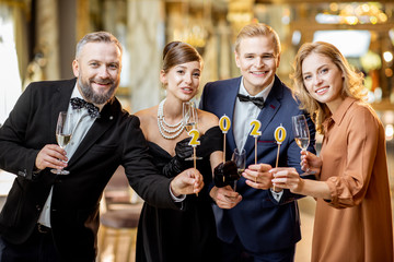 People celebrating New Year holiday indoors