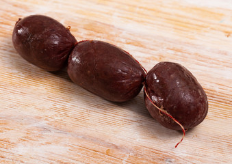 Blood sausages on wooden table