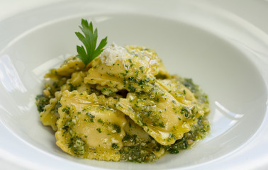 Handmade Italian ravioli filled with creamy ricotta and vibrant pesto—perfect for culinary visuals, menus, or food branding.