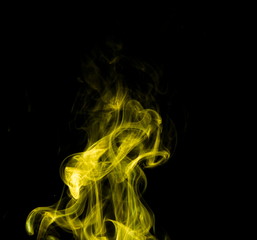 Yellow smoke on black background