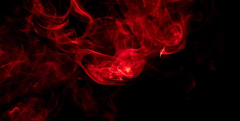 Red smoke on black background