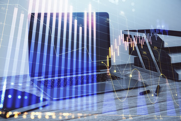 Stock market chart and desktop office computer background. Multi exposure. Concept of financial...