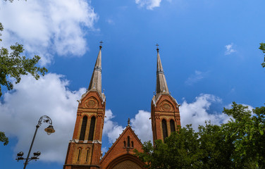 Fototapeta na wymiar Church towers with a blue sky in the background