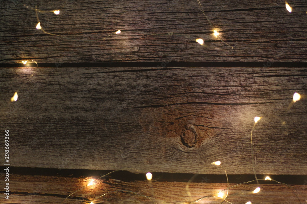 Wall mural christmas light on wood background,