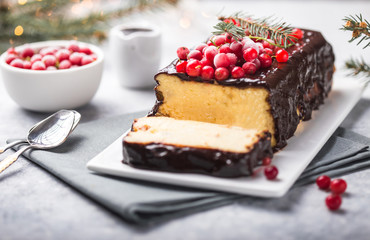 Christmas breakfast. Cottage  cake with cranberries and New year  decorations on a light background.