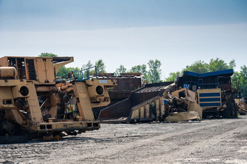 Fototapeta na wymiar remains of old quarry trucks and machinery on junk yard
