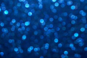 Fototapeta na wymiar blue Sparkling Lights Festive background with texture. Abstract Christmas twinkled bright bokeh defocused and Falling stars. Winter Card or invitation 