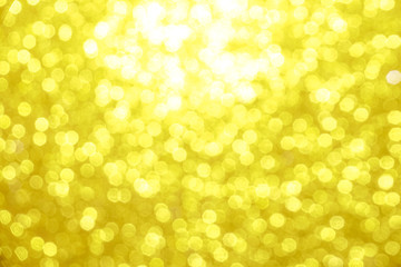 gold Sparkling Lights Festive background with texture. Abstract Christmas twinkled bright bokeh defocused and Falling stars. Winter Card or invitation	