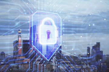 Double exposure of lock icon hologram on cityscape background. Concept of data security