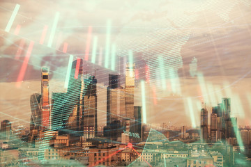 Double exposure of financial graph and world map on city veiw background. Concept of financial market research and analysis