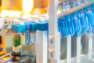 Manufacturing of bottles plastic line, bottle plastic hot blow process transportation raw material by automatic conveyor in the factory