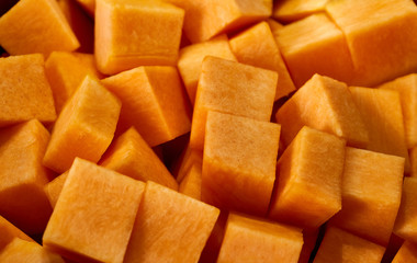 chopped pumpkin lies in a pan