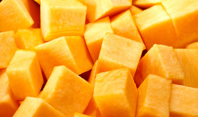 chopped pumpkin lies in a pan