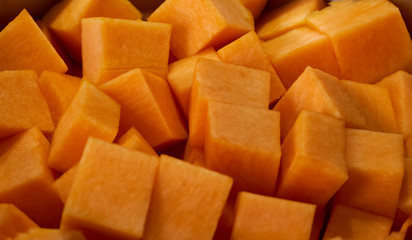 chopped pumpkin lies in a pan