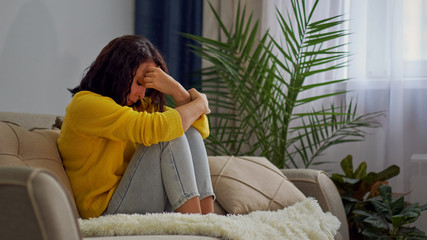 Portrait of a thinking woman. Lonely sad woman deep in thoughts