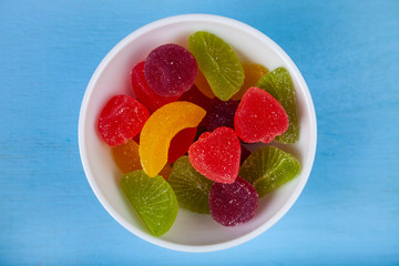 Multicolored marmalade in a bowl