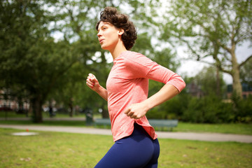 Side of woman running on park