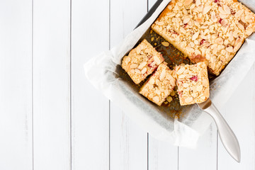 Partly cut Rhubarb Cake in Baking Tray