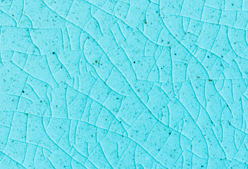 Naklejka premium background and texture of stretch marks cracked on blue glazed tile