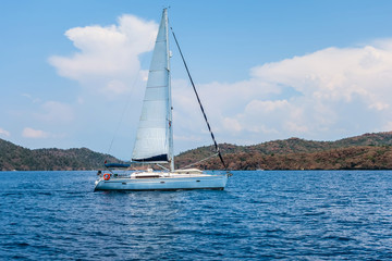 ship white sails a yacht in the Aegean Sea