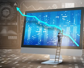 Businessman in economic forecasting concept with charts