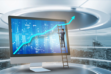 Businessman in economic forecasting concept with charts