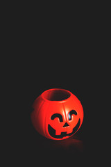 Halloween pumpkin head with golden light in dark night bakckground. Halloween holiday concept.