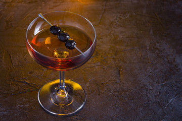 Manhattan cocktail on fireplace background