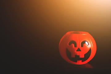 Halloween pumpkin head with golden light in dark night bakckground. Halloween holiday concept.