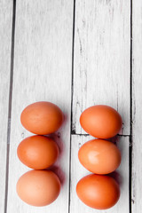 white egg on white wooden table