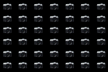 Mirrorless camera on a black background.