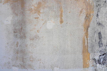 Stains and cracks on the old concrete wall for rustic and grungy background and decoration. Art and interior concept