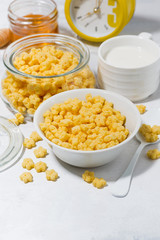 breakfast cereal for children - crispy stars on white table, vertical
