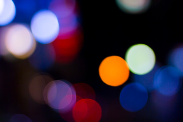 The night, blue, red and purple bokeh are the perfect background for the festival as an abstract image.