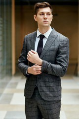 Confident gentleman in grey suit looking away, ready to marry. People, fashion concept