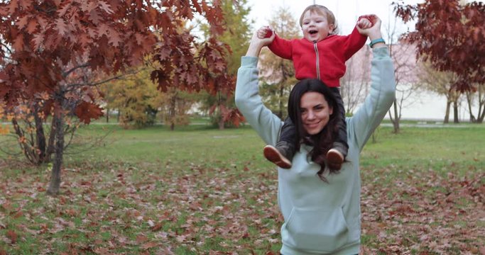 Infant boy in mother s arms indulges