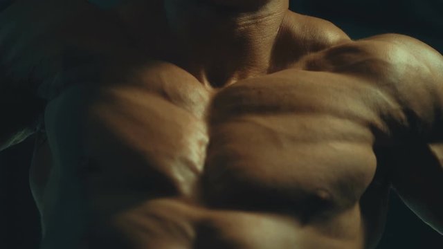 Handsome athletic men pumping up muscles push-ups on uneven bars workout fitness exercises and bodybuilding concept background - muscular bodybuilder fitness men doing bars exercises in gym torso