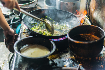 Local food cooked in a street restaurant in Hanoi, Vietnam