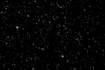 real snowflakes isolated on black background