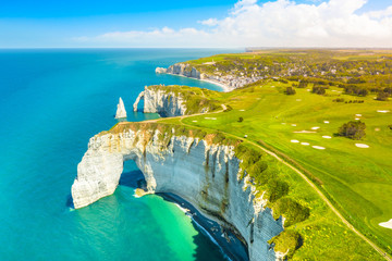 Picturesque panoramic landscape on the cliffs of Etretat. Natural amazing cliffs. Etretat, Normandy, France, La Manche or English Channel. Coast of the Pays de Caux area in sunny summer day. France - obrazy, fototapety, plakaty