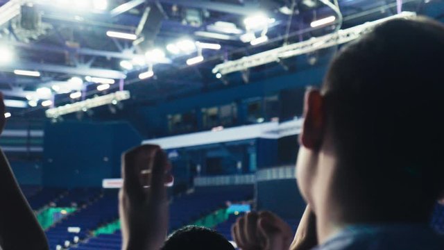 fans clap hands at competitions on stadium slow motion