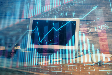 Multi exposure of forex graph and work space with computer. Concept of international online trading.