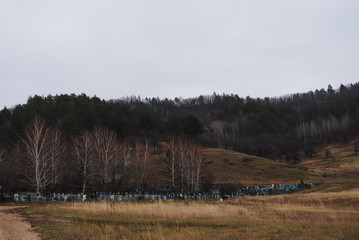 old cemetery under the mountain in autumn