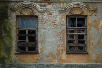 Fototapeta na wymiar Windows of an abandoned old house, 19th or early 20th century, Voronezh, Russia.